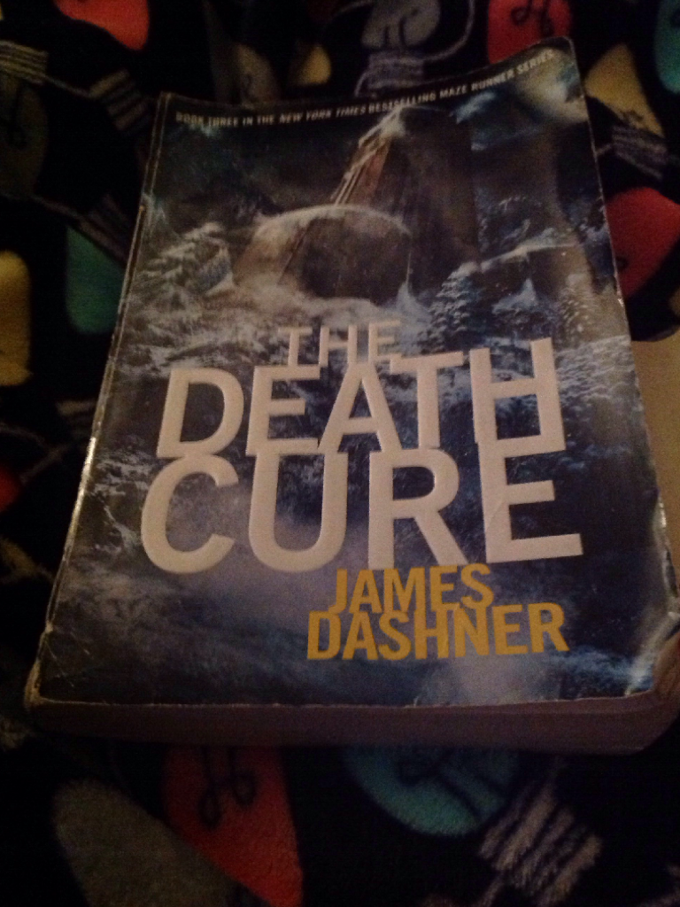 Day 24: what I'm reading is the death cure by James Dashner ( The third book to the maze runner )