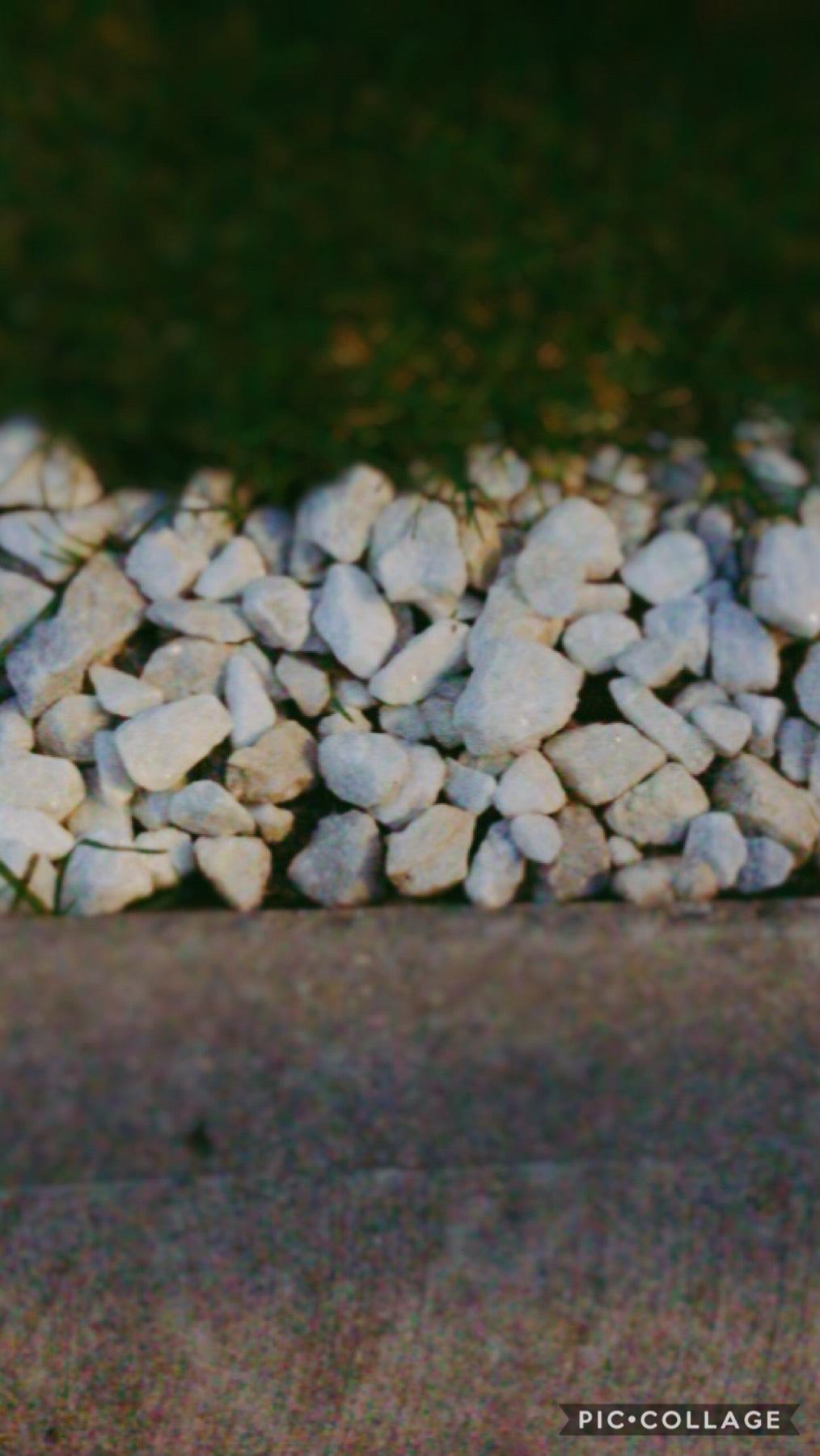 Beautiful combo of the grass, pebbles And pavement.
