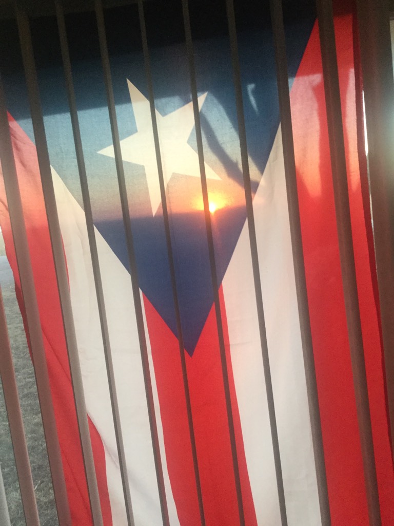 Here’s the sunset through the Puerto Rican flag hanging in the window, my stepdad is from Puerto Rico 🇵🇷 so that’s why it’s hanging there