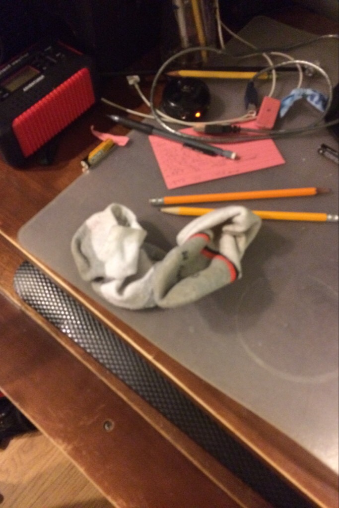 My brother has decided to leave his socks on the computer table.