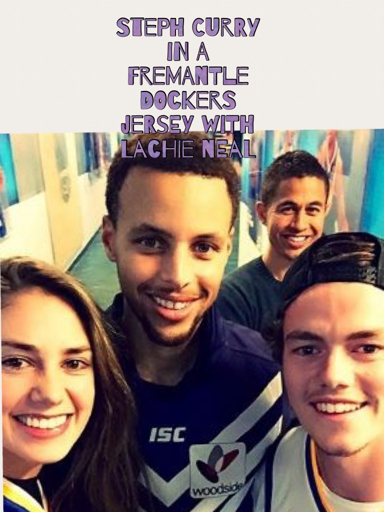 Steph curry in a Fremantle dockers jersey with lachie neal